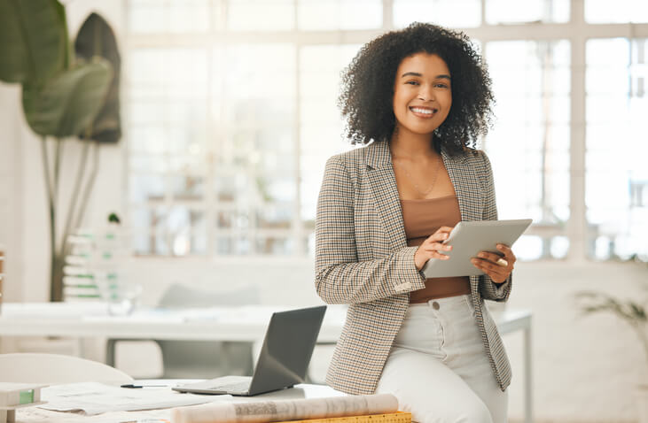 A young woman using a digital tablet after Business Office Management Training