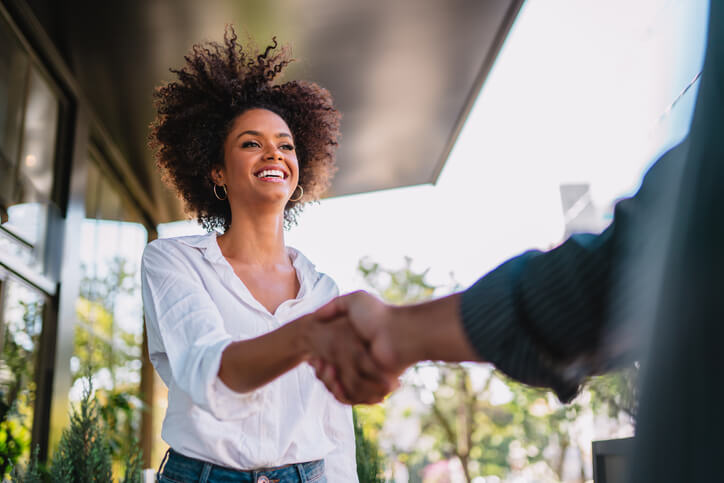 community safety training grad shaking hands with a legal official