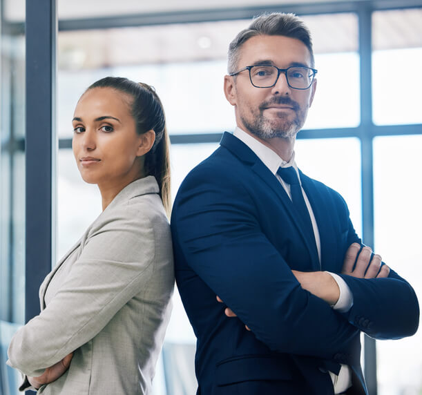 Two business people standing side by side after their international trade training