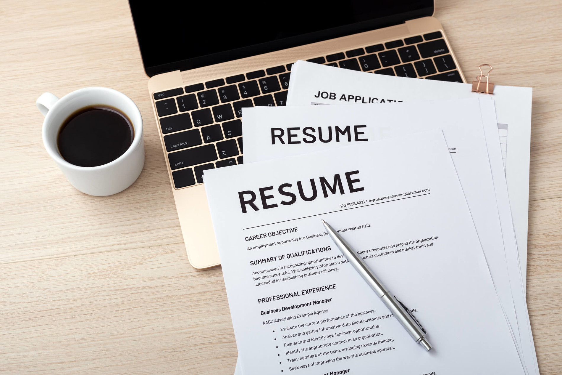 A female healthcare professional working on a resume after completing her healthcare assistant training