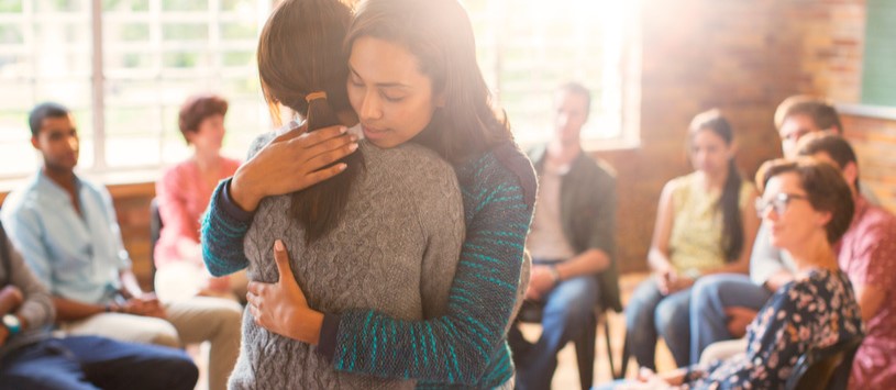 Mental Health Worker hugging a client.