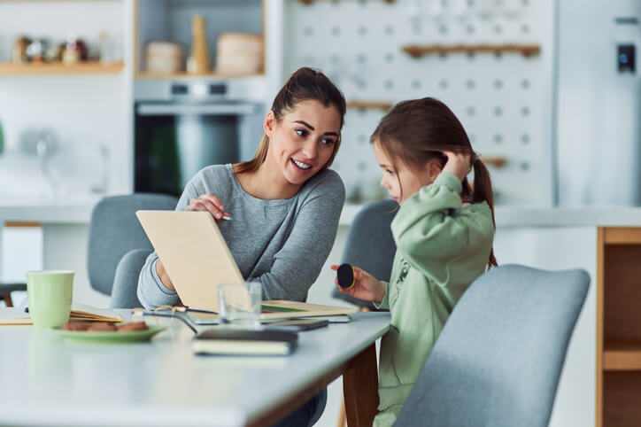 A child learning with an education assistant specializing in mental health and academic outcomes after training.