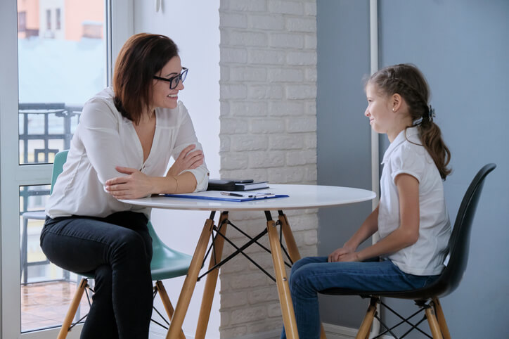 A community support worker at a school counseling student.