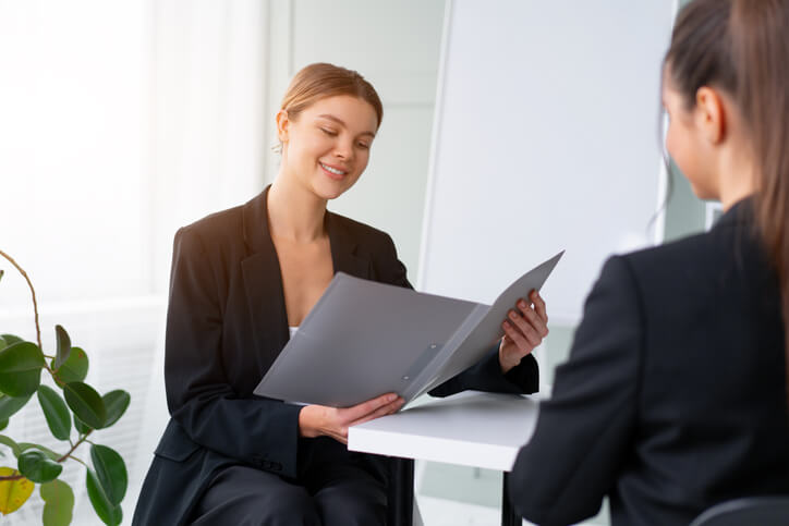 A graduate securing a job interview through a referral after career training
