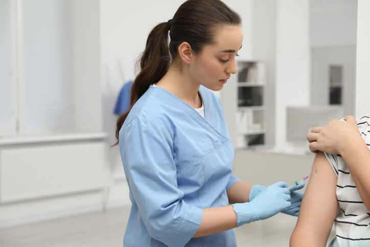 A licensed practical nurse administering care in a clinic
