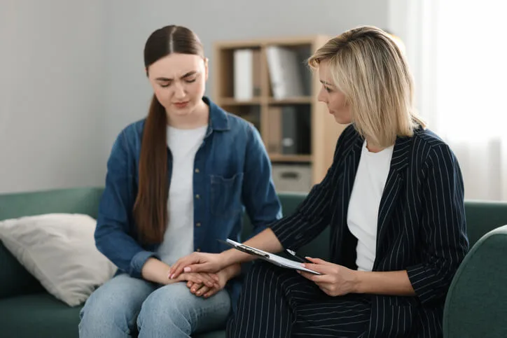 A community support worker practicing trauma-informed care with client
