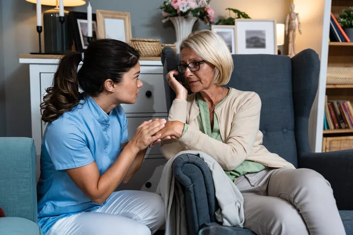 An HCA student practicing active listening during healthcare assistant training