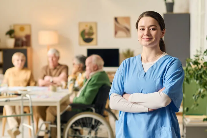 A Health Care Assistant works with a senior in a long-term care facility.
