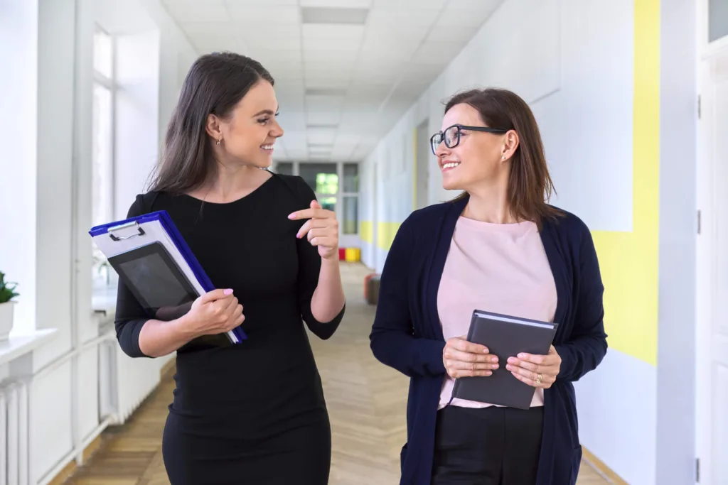 An Education Assistant working alongside a classroom teacher in a British Columbia school